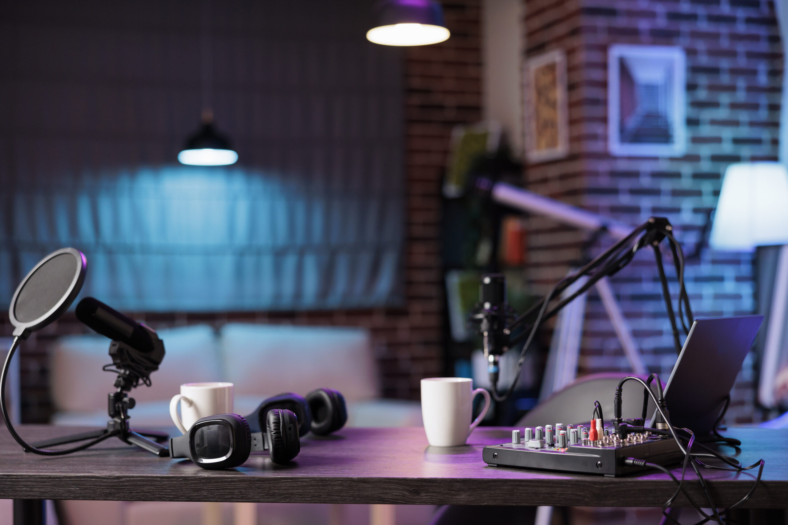 Empty home production studio with professional podcasting tools recording sound for streaming sites entertainment show. Live broadcasting from cozy location in living room decorated with purple lights