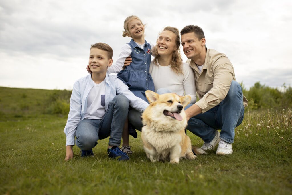 full-shot-happy-family-with-dog